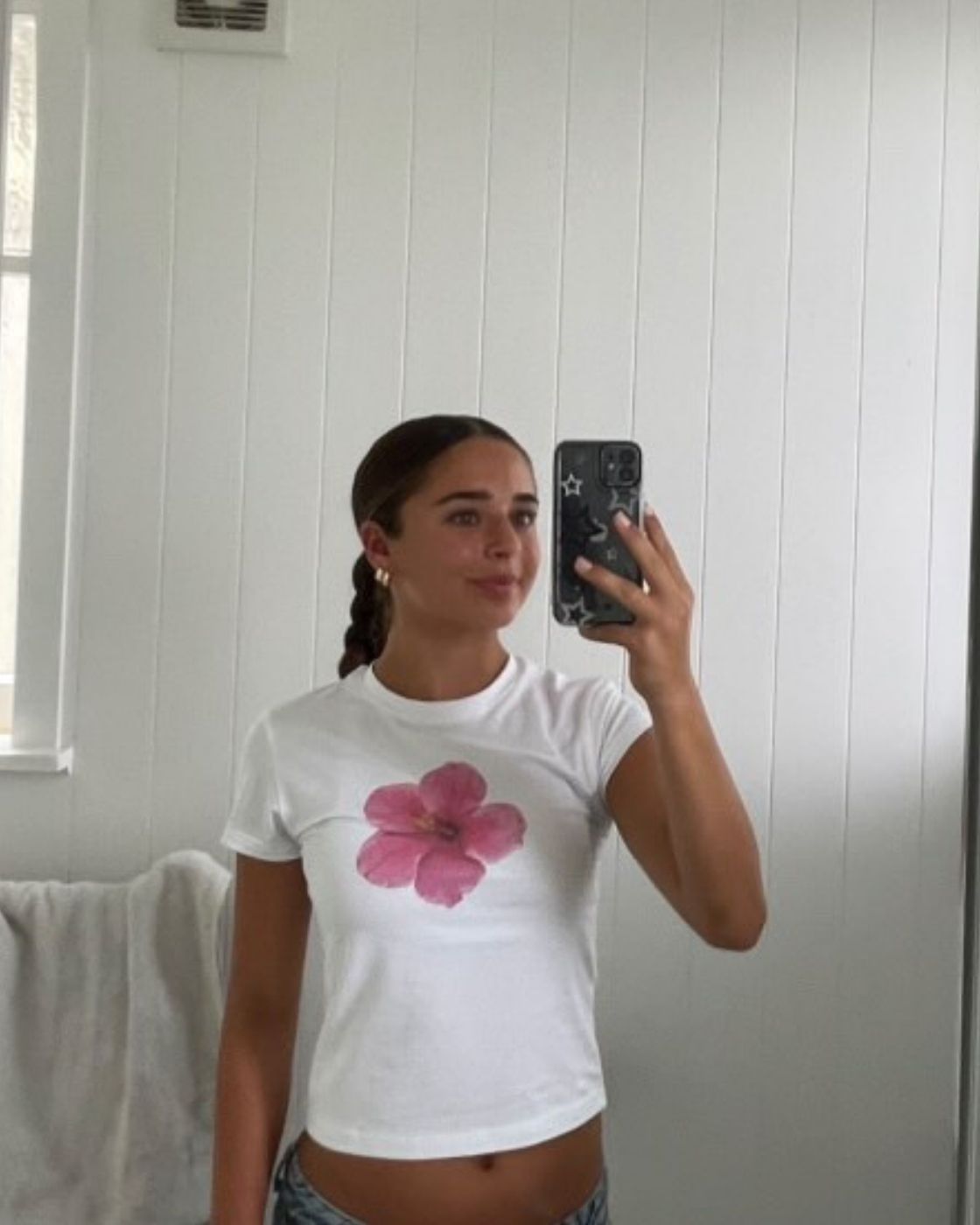 Blaire ambassador styling the Hibiscus Baby Tee with low rise denim, Gen Z fashion.