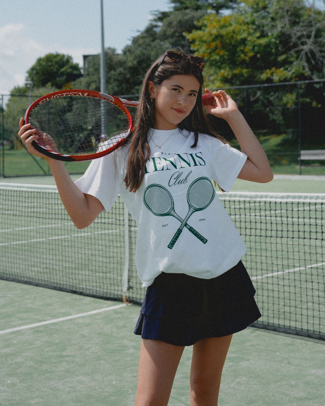 Model wearing Blaire Tennis Club Tee, front view showcasing oversized fit and tennis club graphic.